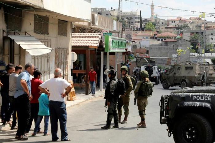 Israeli security forces deployed in Azzun following the attack