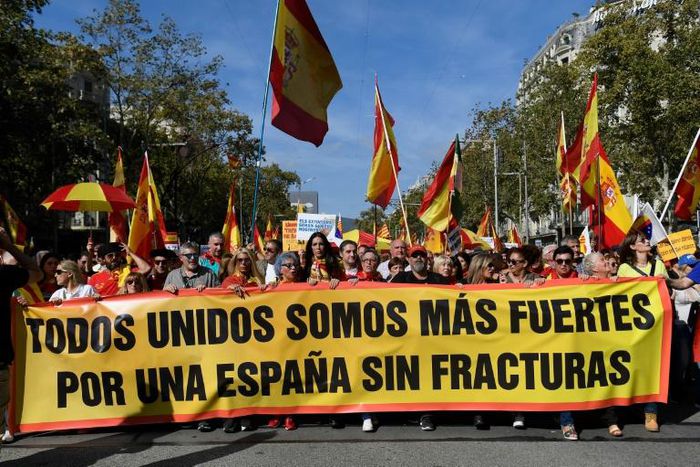 Demonstrators waving Spanish and Catalan flags brandished a banner reading "together we are stronger -- for a Spain without fractures"