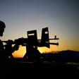 An Afghan soldier mans a machine gun mounted on a vehicle while patrolling Guzara, Herat province