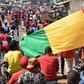 Demonstrators take part in a protest against the third term of Guinean President Alpha Conde, in Conakry, on November 26