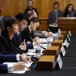 Prominent activist Joshua Wong (L) and Cantopop star Denise Ho (C) testified before a congressional commission about the pro-democracy movement in Hong Kong
