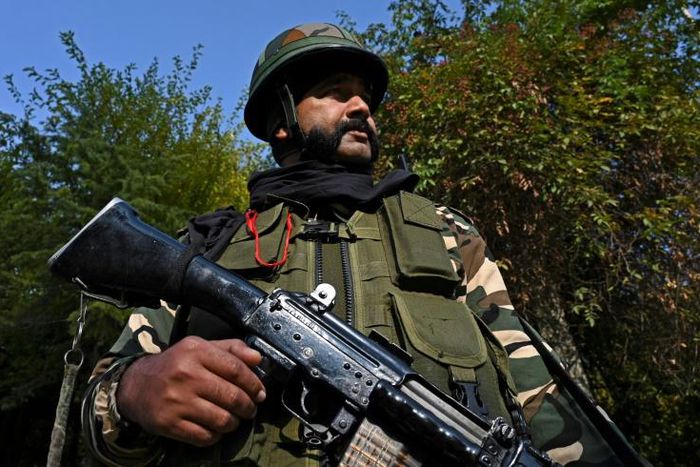 A soldier stands guard near Raj Bhavan, the official governor's residence, ahead of the swearing-in ceremony of first lieutenant governor of Jammu and Kashmir union territory, in Srinagar