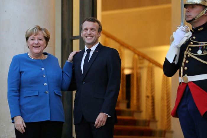 German Chancellor Angela Merkel says she and French President Emmanuel Macron want to arrive in Brussels with "common positions in so far as possible"