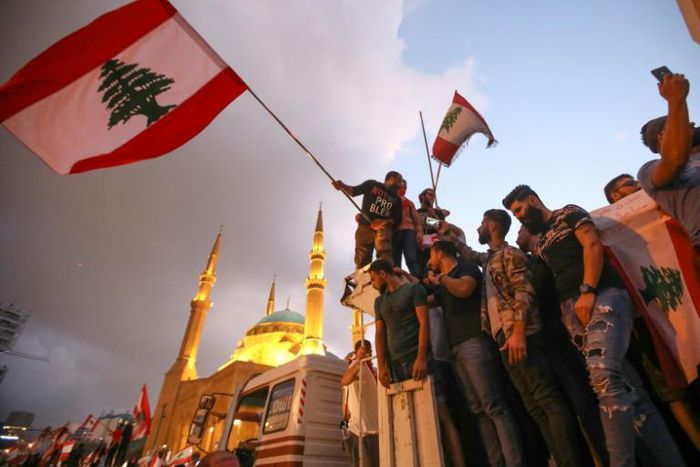 Hundreds of thousands of people have joined protests demanding a sweeping overhaul of Lebanon's political system