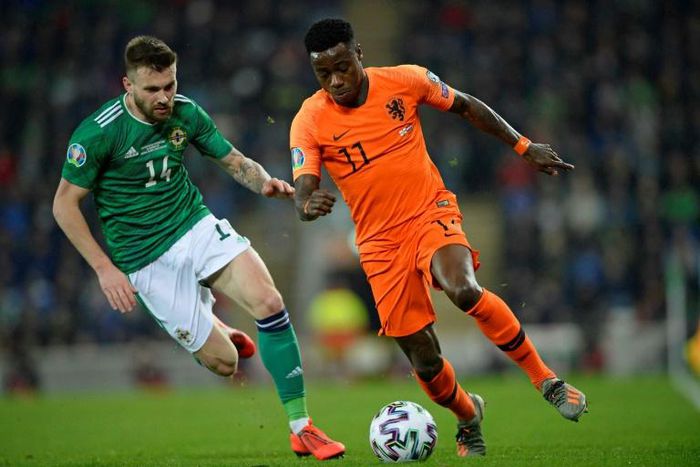 Netherlands winger Quincy Promes vies with Northern Ireland's Stuart Dallas during their goalless draw