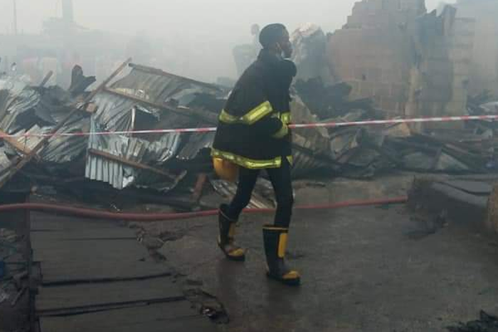 A Lagos State firefighter at scene of the incident [Punch]