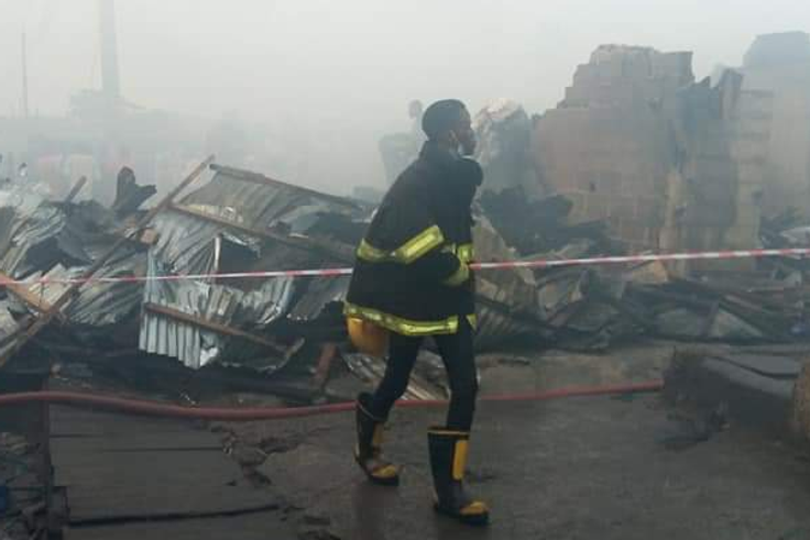 A Lagos State firefighter at scene of the incident [Punch]