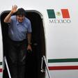 Bolivian ex-President Evo Morales waves upon landing in Mexico City, on November 12, 2019, where he was granted exile after his resignation