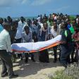 Relatives and fellow journalists pray as they stand next to the body of journalist Abdulaziz Ali Haji during his 2016 funeral in Somalia, described by a watchdog group as the worst country for enabling impunity for deadly attacks on media