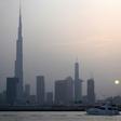 With the highest building in the world, Burj Khalifa (left), grand commercial centres and artificial islands, Dubai projects an image of prosperity