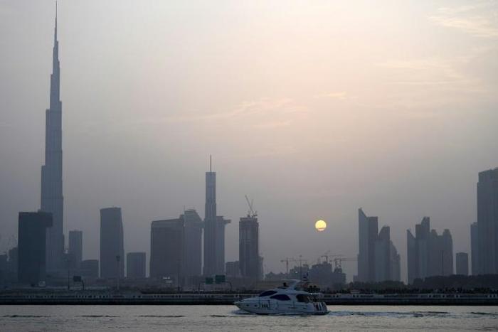 With the highest building in the world, Burj Khalifa (left), grand commercial centres and artificial islands, Dubai projects an image of prosperity