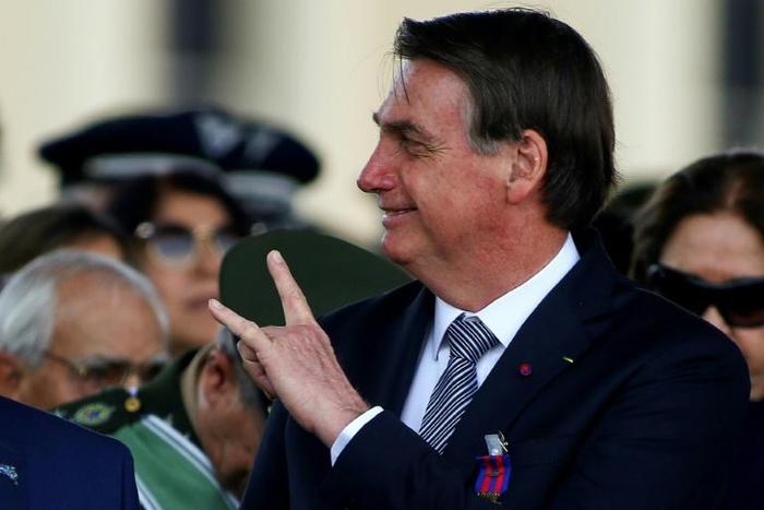 Brazilian President Jair Bolsonaro, pictured here in August 2019, said he would return to work after another operation following his stabbing a year ago