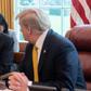 China's Vice Premier Liu He (L) speaks with US President Donald Trump during a trade meeting in the Oval Office at the White House in Washington in April 2019