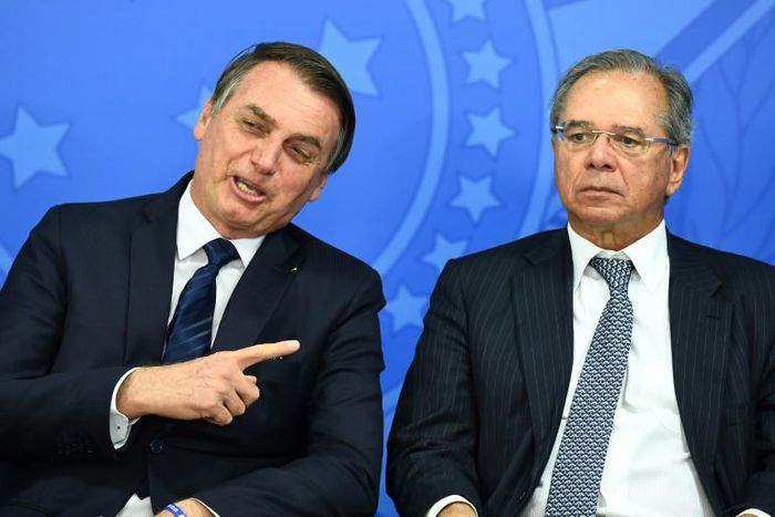 Brazilian President Jair Bolsonaro (L) is seen with his economy minister Paulo Guedes in July 2019