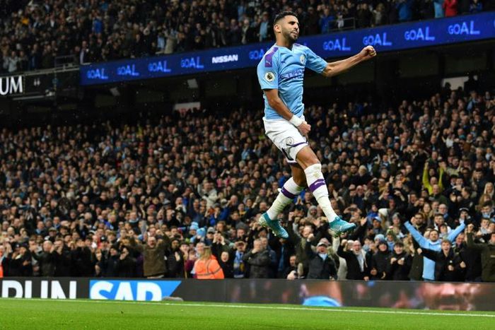 Algerian Riyad Mahrez leaps to celebrate scoring the second goal for Manchester City in a 2-1 win over Chelsea