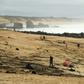 People on the beach Monday at Capbreton, southwestern France, where packages of cocaine have been found in recent days.