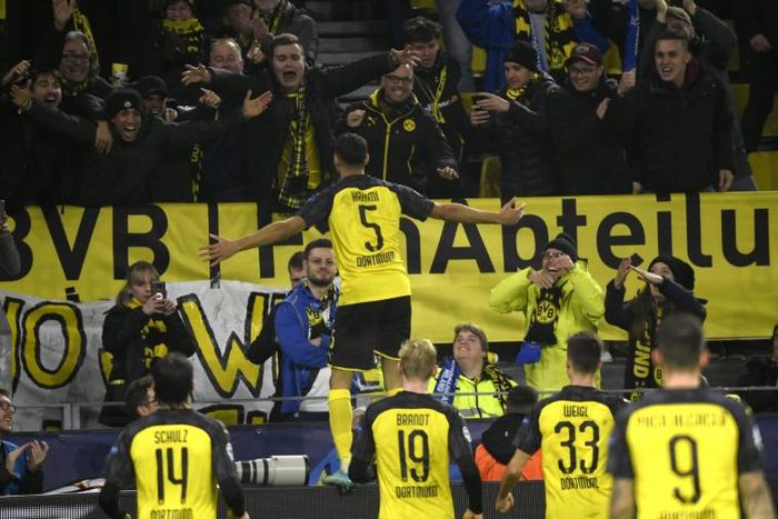 Achraf Hakimi celebrates in front of Borussia Dortmund fans after sealing a 3-2 win over Inter Milan in the Champions League