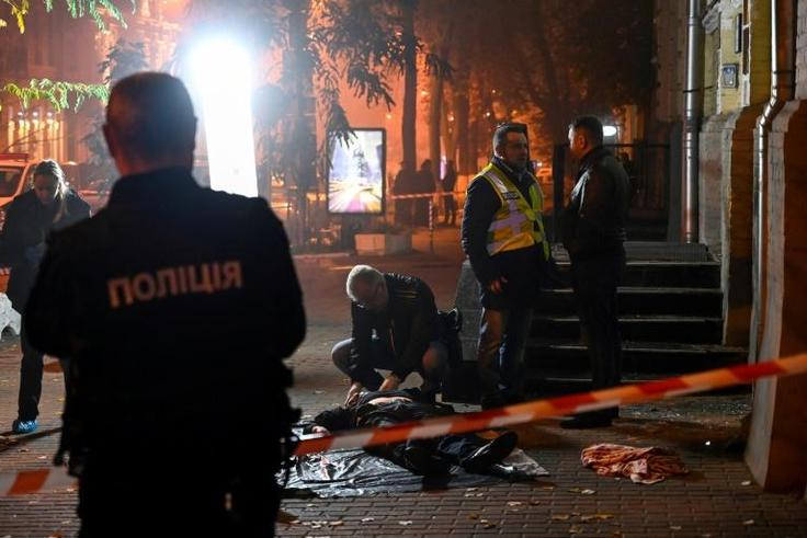 The blast left two men dead and a woman injured at the entrance to an office building in the centre of the capital Kiev