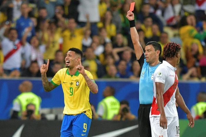 Chilean referee Roberto Tobar shows the red card to Brazil's Gabriel Jesus in the Copa America final at Rio de Janeiro's Maracana stadium