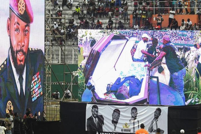 DJ Arafat's coffin was placed at the centre of the football pitch