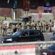 Lebanese soldiers get the traffic flowing again after removing protesters' roadblocks as the government's resignation under pressure from the streets looks set to ease a two-week-old lockdown