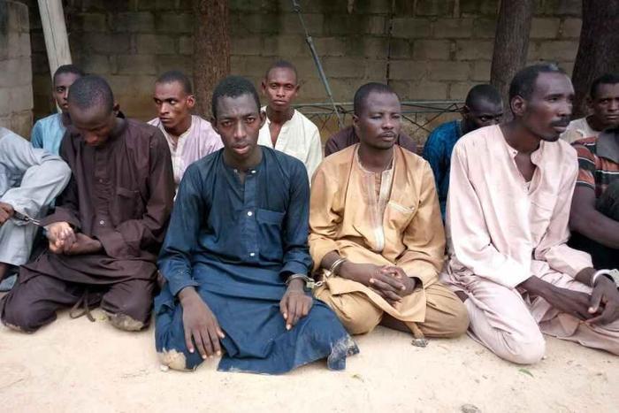 A group of men identified by Nigerian police as Boko Haram extremist fighters and leaders are shown to the media, in Maiduguri, Nigeria, Wednesday, July 18, 2018. A Nigerian police official says authorities have arrested 22 Boko Haram extremist leaders...