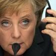 German Chancellor Angela Merkel says if the Berlin hadn't fallen, she would have driving around the US listening to Bruce Springsteen