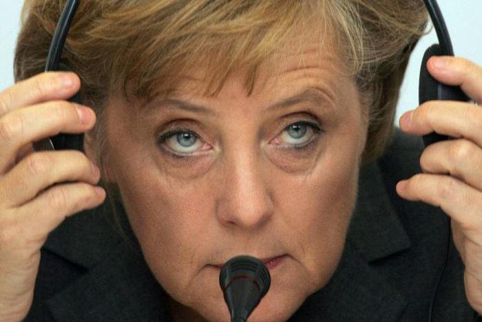 German Chancellor Angela Merkel says if the Berlin hadn't fallen, she would have driving around the US listening to Bruce Springsteen