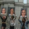 Protest group called "Hot Mess" hold up photos of Jeffrey Epstein in front of the Federal courthouse in New York City