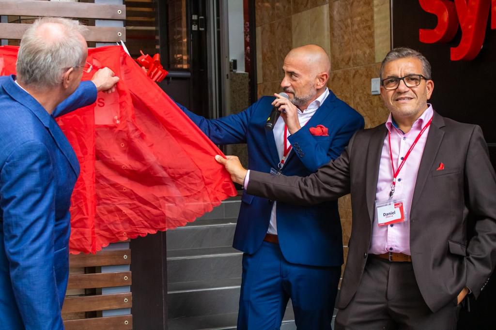 Thomas Dressler, President EAME Fragrances and Oral care, Alexander Lichter, Vice President Flavour Sales EAME and Daniel Ibarra, Vice President EAME Cosmetic Ingredients Division cutting the ribbon during the official opening of Symrise Laboratories F...