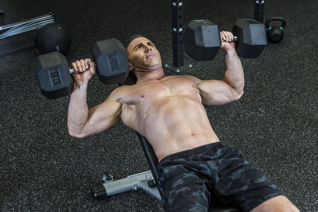 Man doing dumbbell bench press