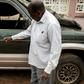 Filipe Mahanjane points to bullet holes in the car where election observer Anastacio Matavele was slain in Xai-Xai, Mozambique
