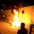 Iraqi demonstrators set fire to tyres outside the Iranian consulate in the holy city of Karbala