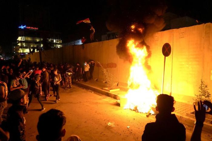 Iraqi demonstrators set fire to tyres outside the Iranian consulate in the holy city of Karbala