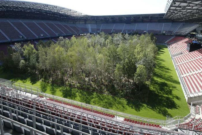 The temporary art intervention "For Forest - The Unending Attraction of Nature" by Klaus Littmann has turned the Woerthsee football stadium in Klagenfurt, Austria into a forest, consisting of about 300 trees