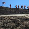 Tens of thousands of residents in southern California fled their homes as the so-called Tick Fire scorched over 4,000 acres (1,618 hectares)
