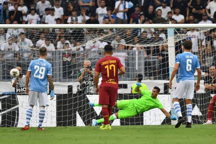 AS Roma's Aleksandar Kolarov (R) scores a penality against Lazio at the Olympic stadium in Rome.