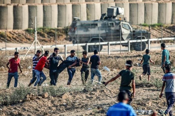 Two Palestinian teenagers and 46 other protesters were wounded during weekly demonstrations along the Gaza border on Friday