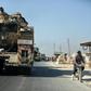 A convoy of Turkish military vehicles passes through the town of Saraqeb in Idlib province on August 19, 2019
