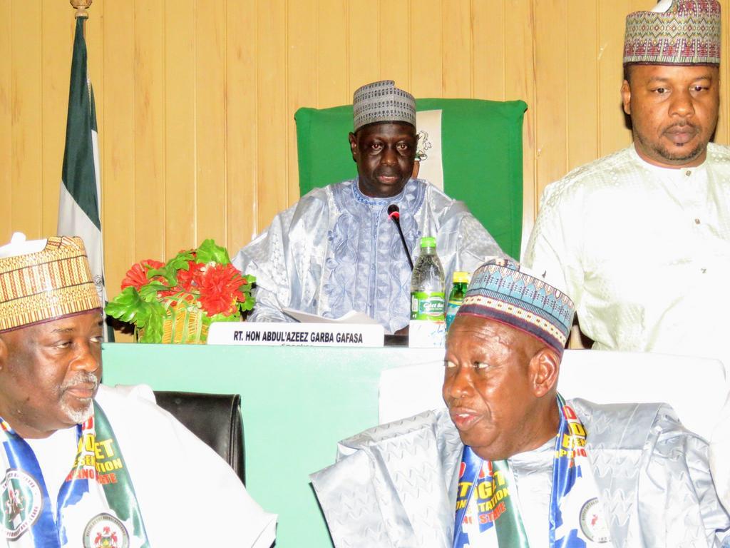 Speaker of the State Assembly, Alhaji Abdulazeez Garba-Gafasa, Governor Umar Ganduje accompanied by his Deputy and a media aide at the 2020 budget presentation at Kano assembly. [Twitter/@musayaro42]