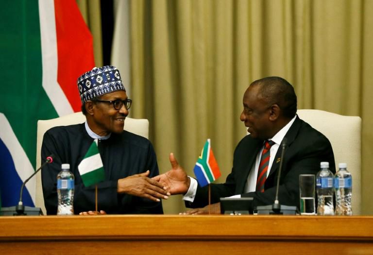 Handshake: Buhari, left, and Ramaphosa