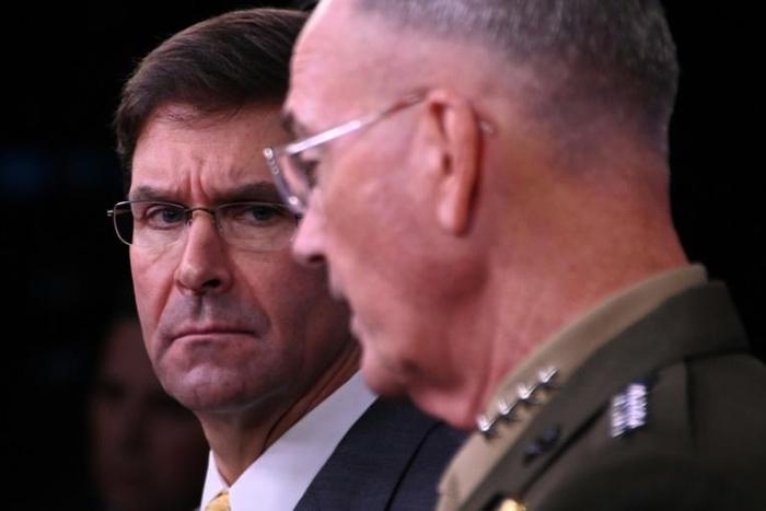 US Defense Secretary Mark Esper (left) listens to the Chairman of the Joint Chiefs of Staff General Joseph Dunford during a press conference at the Pentagon
