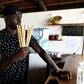 Copacabana restaurant owner Babacar Thiaw holds bamboo straws, replacing plastic straws -- a major and lasting source of marine pollution