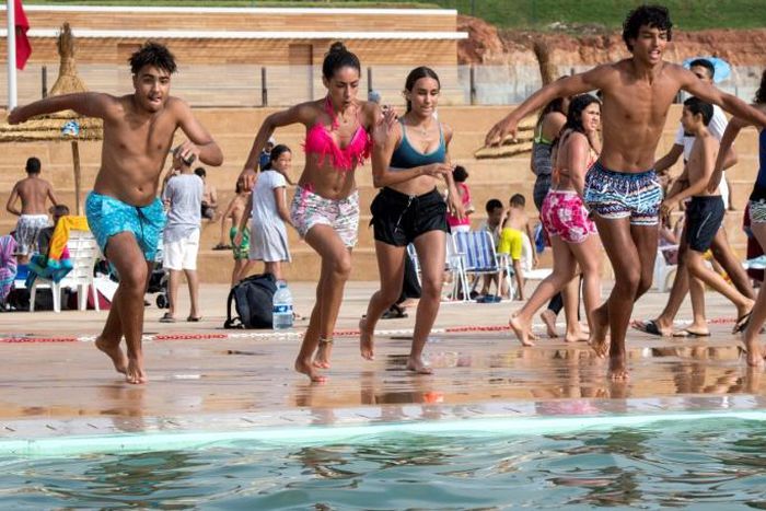 Thousands of Moroccans are flocking to the artificial pools carved into the rocky outcropping of the urban corniche in the capital Rabat