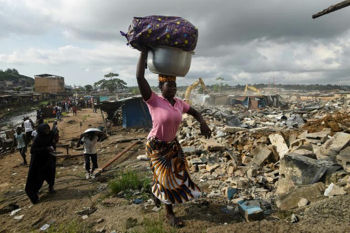 Residents of the Boribana neighbourhood in Abidjan salvage belongings as demolition of the district gets underway