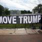 Activists hold a banner asking for the impeachment of US President Donald Trump on November 5, 2019 in front of the White House in Washington, DC