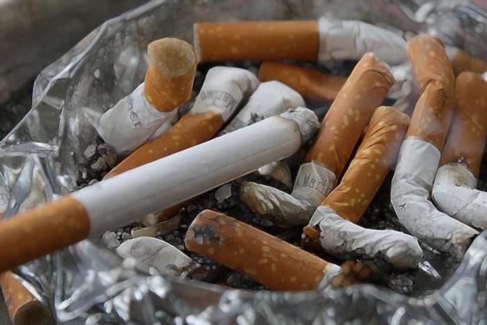 A ash tray containing cigarette butts (NAN)