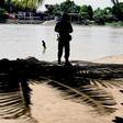 A member of the Mexican National Guard patrols the banks of the Suchiate River in Chiapas State, Mexico, in July 2019 in an effort to prevent illegal migrant crossings