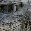 Turkey-backed Syrian fighters inspect the site of a car bomb explosion in the northern Syrian town of Tal Abyad, on the border with Turkey, on Saturday