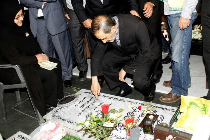 Ali Akbar Velayati, who has been slapped with sanctions by the United States and serves an adviser to Iran's supreme leader Ayatollah Ali Khamenei, prays over the tomb of a Hezbollah fighter at a cemetery in Beirut's southern suburbs in May 2015